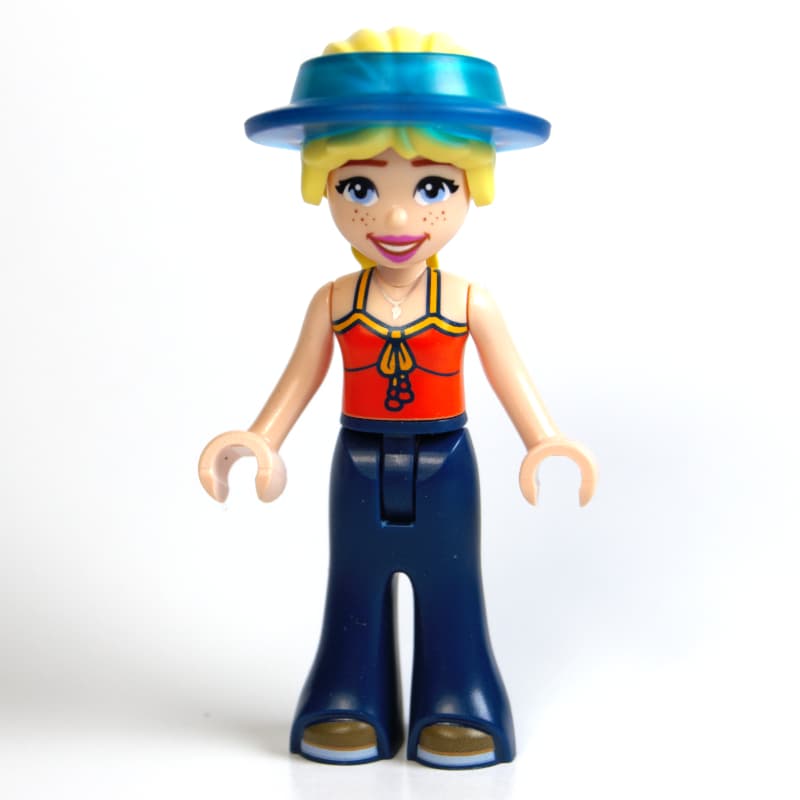 Astrid, Reddish Orange Top, Dark Blue Pants, Visor